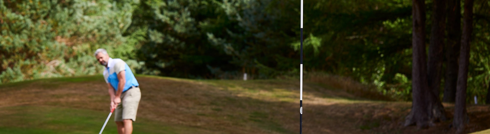 Golfer at Cardrona Golfer putting at Cardrona