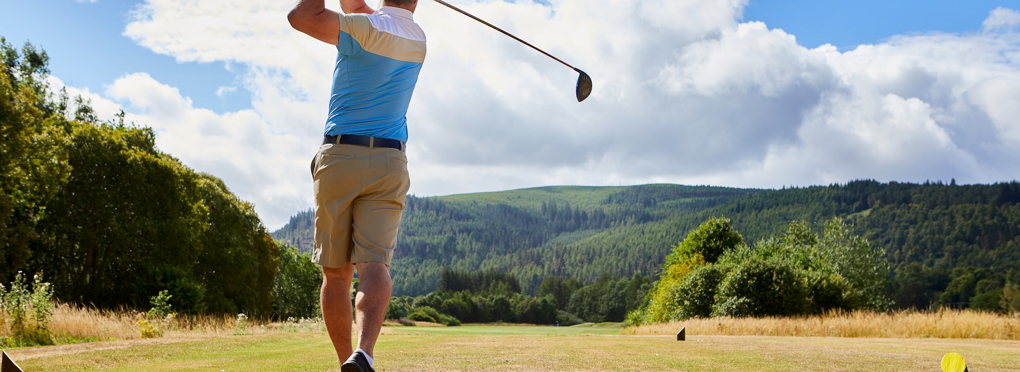 Golfer at Cardrona Golfer teeing off at Cardrona