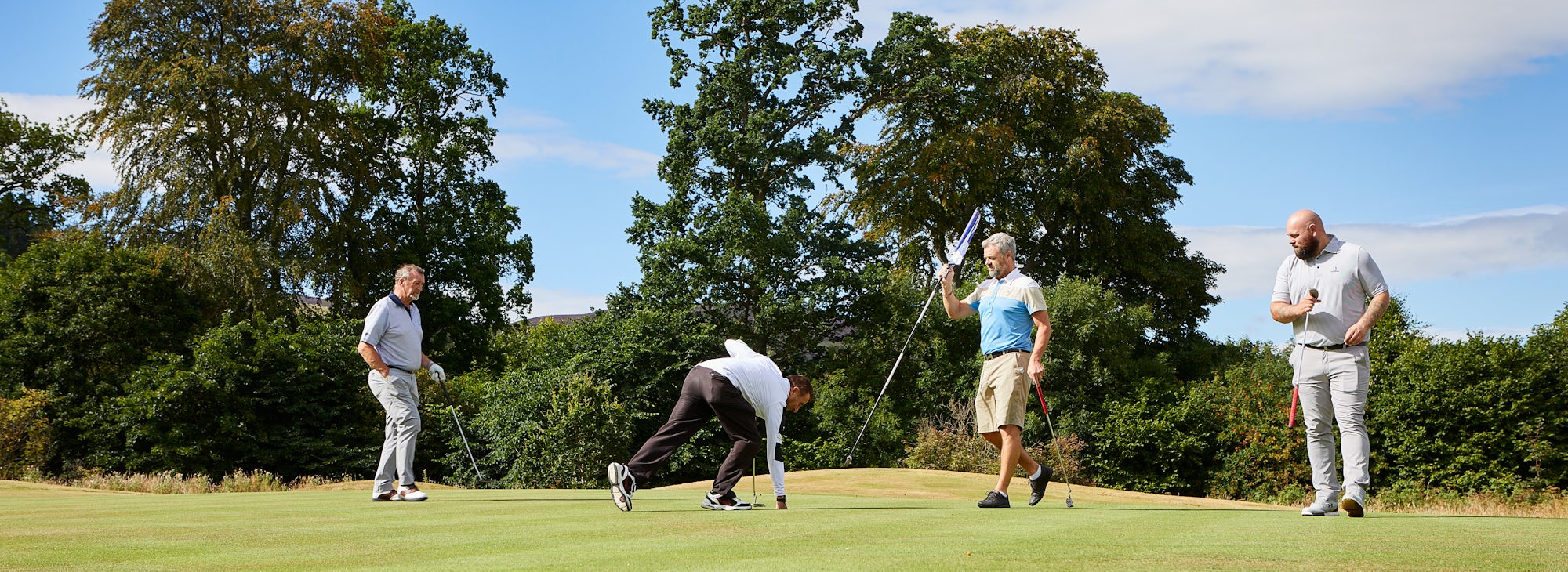 Golfers at Cardrona Golfers on the green at Cardrona