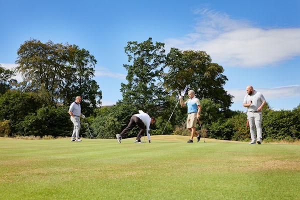 Golfers on the green at Cardrona