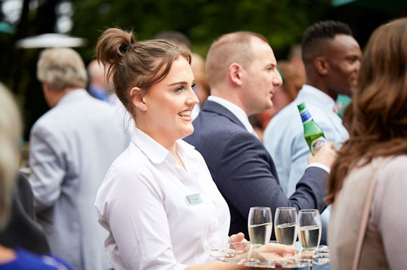 Frimley Hall Wedding Staff Serving Champagne