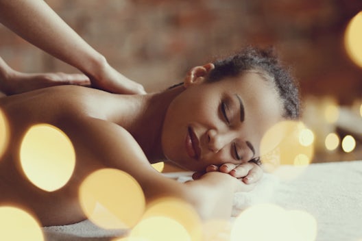 A woman enjoys a massage