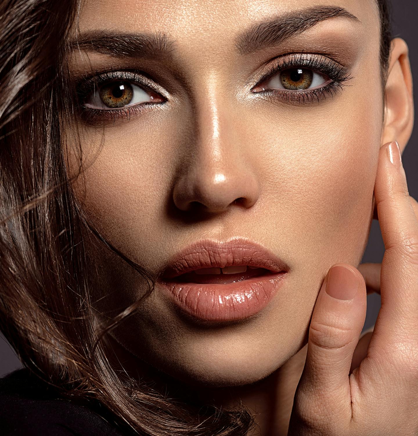 Brunette woman with smooth, full lips. Close up.