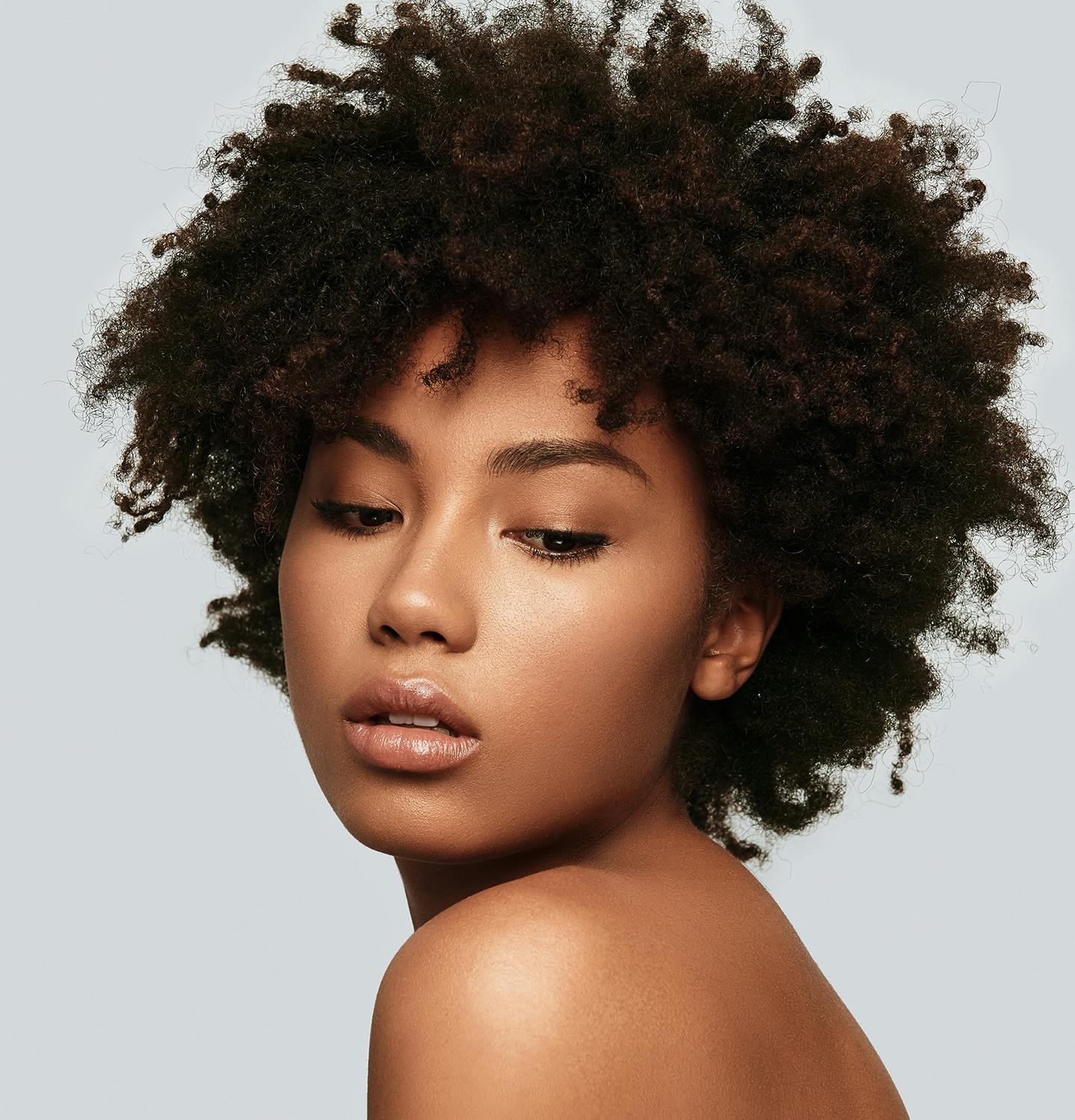 there is a woman with a very large afro hair posing for a picture