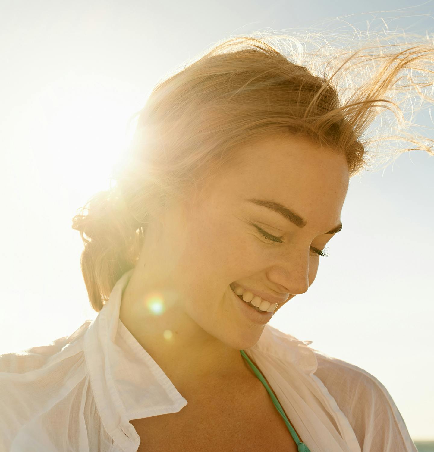 woman looking down smiling