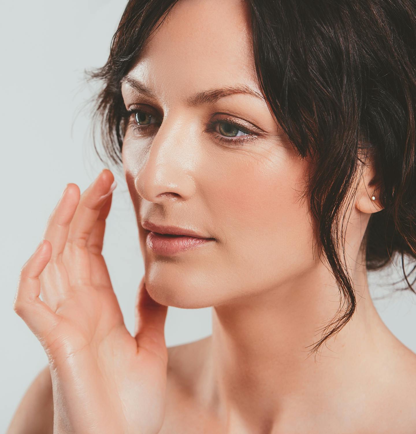 woman about to touch face