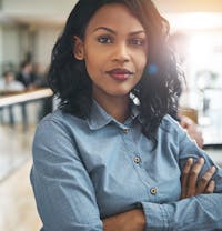 there is a woman that is standing with her arms crossed