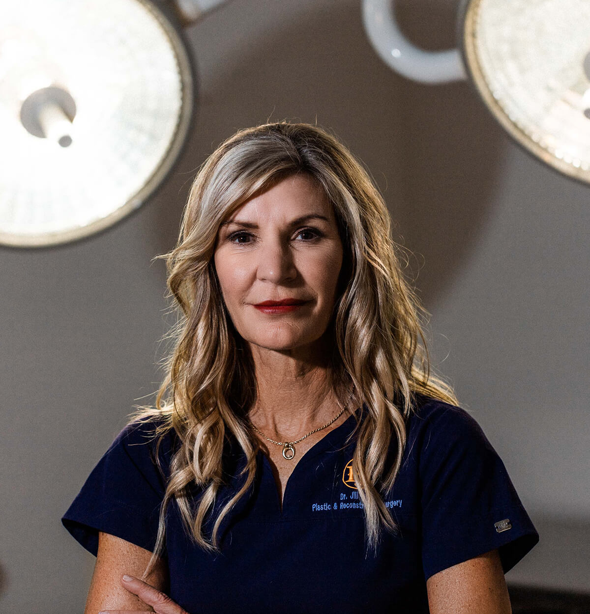 Dr. Jill Hazen in front of operation lights