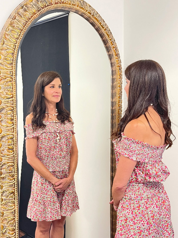 woman looking in mirror