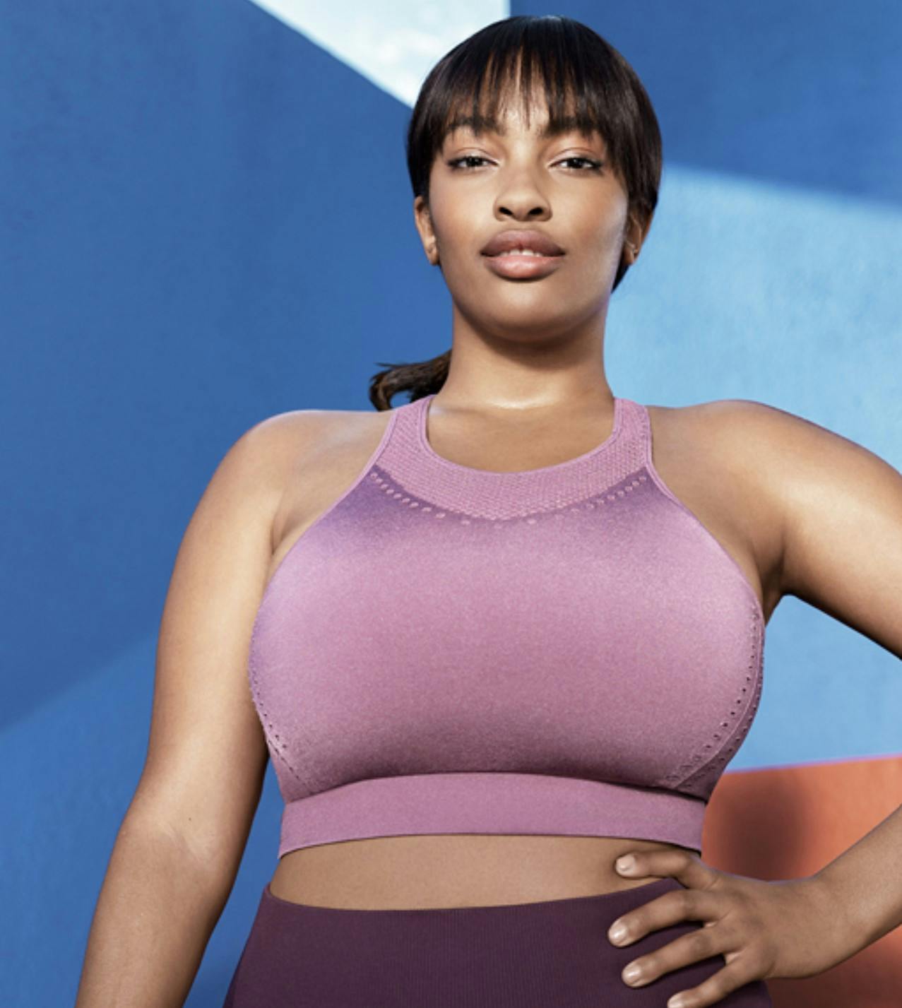 woman in purple top looking at camera