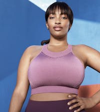 woman in purple top looking at camera