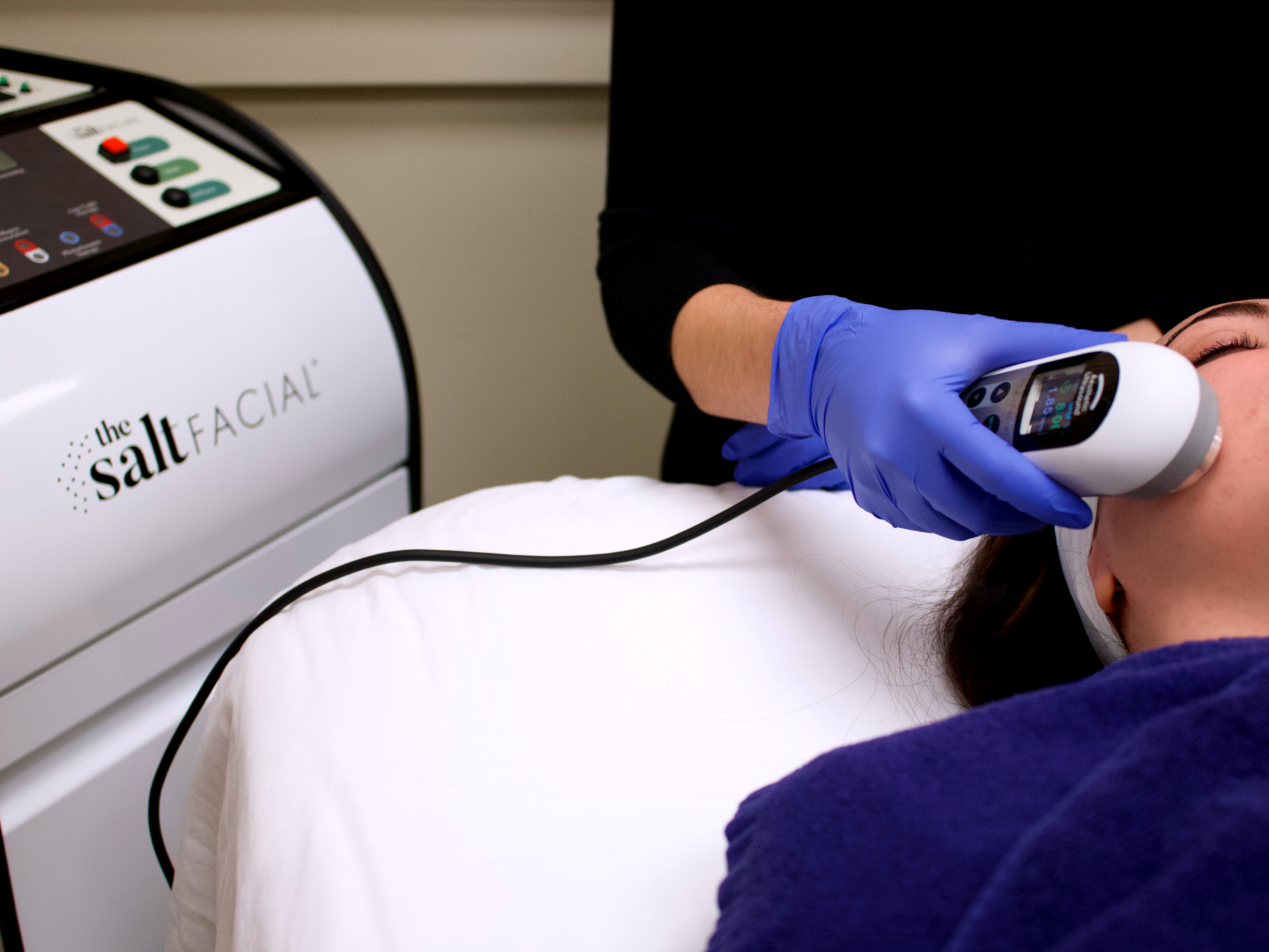 machine being used on woman's cheek