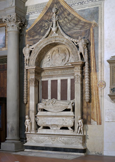 Desiderio da Settignano, “Tomba monumentale di Carlo Marsuppini”, 1454-1459, marmo e affresco. Firenze, Santa Croce, navata sinistra