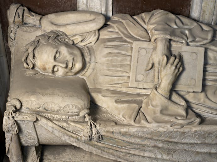 Desiderio da Settignano, “Ritratto funebre di Carlo Marsuppini”, particolare della “Tomba monumentale di Carlo Marsuppini”, 1454-1459, marmo e affresco. Firenze, Santa Croce, navata sinistra  Desiderio da Settignano, “Ritratto funebre di Carlo Marsuppini”, particolare della “Tomba monumentale di Carlo Marsuppini”, 1454-1459, marmo e affresco. Firenze, Santa Croce, navata sinistra