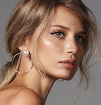 Woman with beautiful eyes and bright skin.