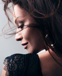 Profile of stunning woman with exquistie cheeks.