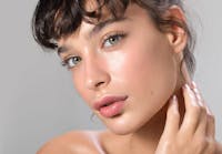 Brunette Woman looking into camera