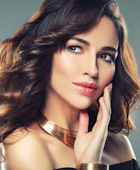 Elegant woman stunning eyes looking off.