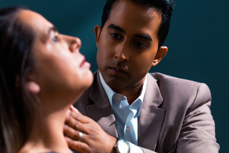 Dr. Rana Examining a Patients Neck