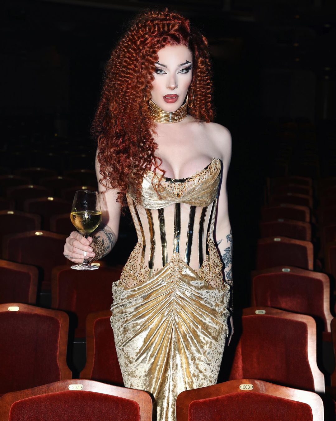Woman with red hair and gold dress