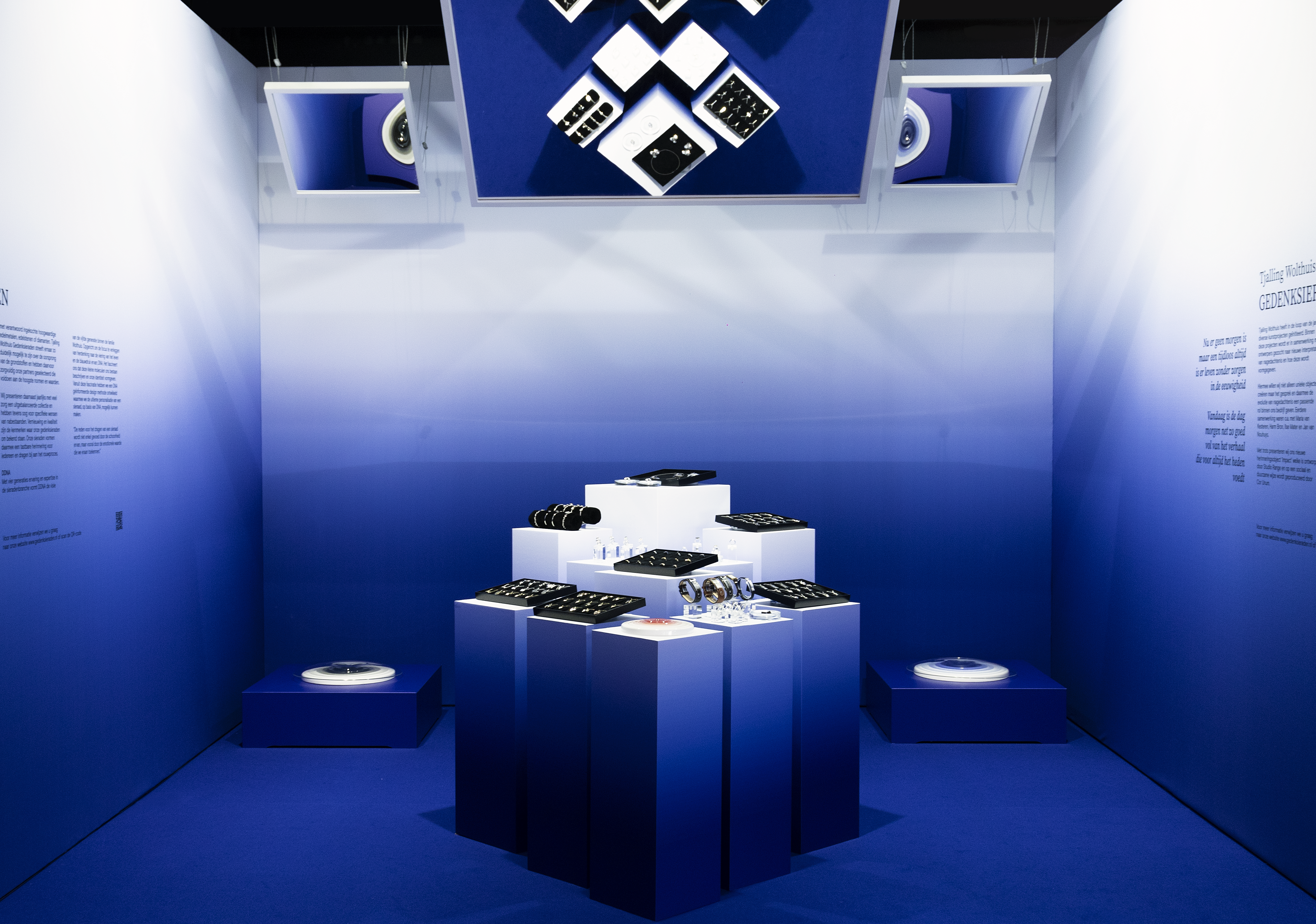 Installation design with an overal blue gradient and 3 suspended mirrors