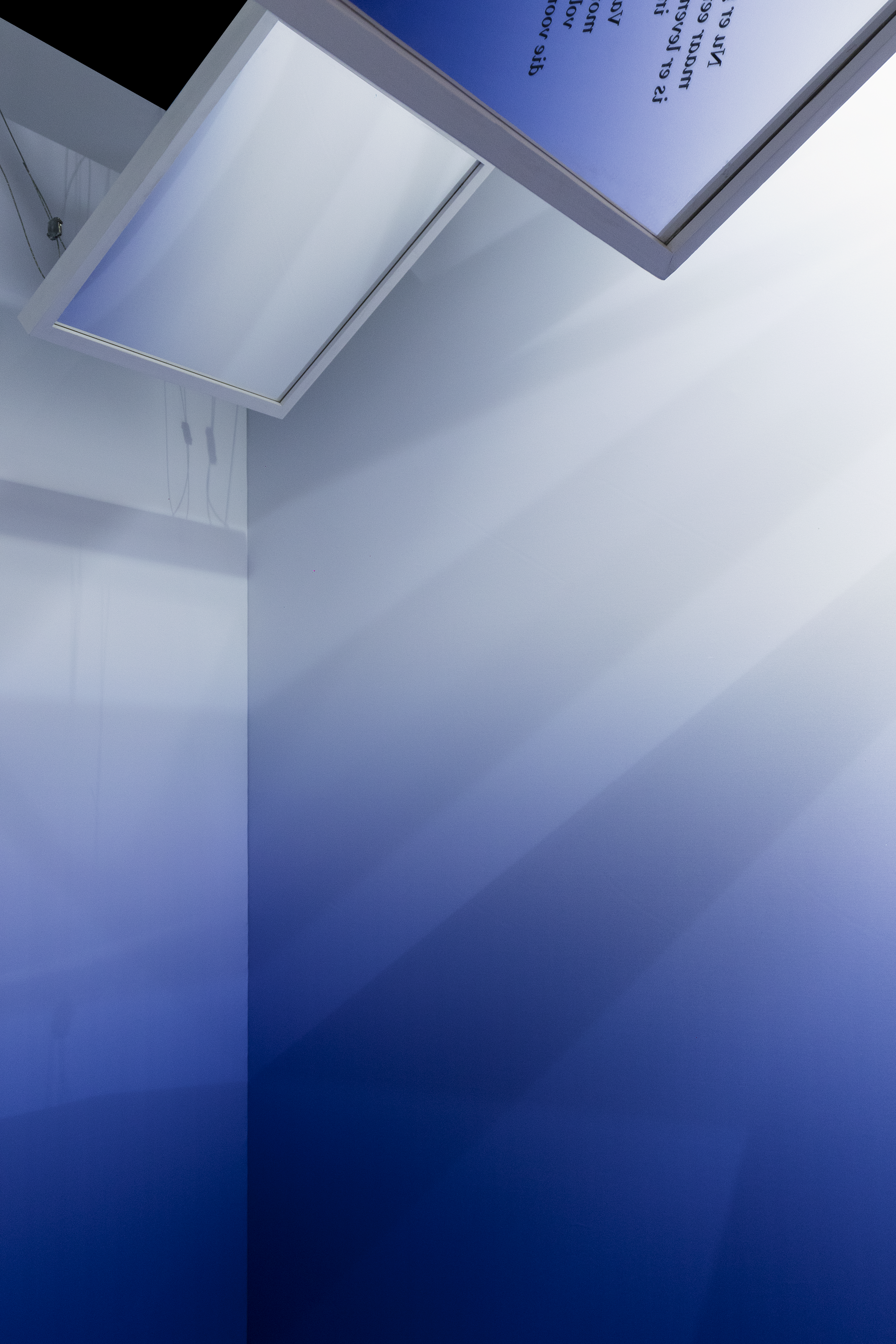 Installation design with an overal blue gradient and 3 suspended mirrors