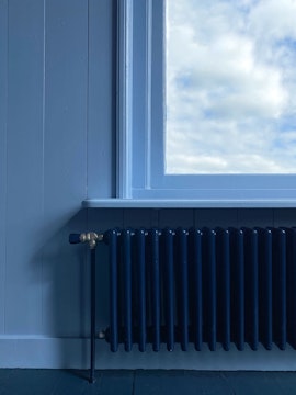 blue interior, view out of the window with blue sky