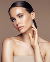 Beautiful woman hand along neck