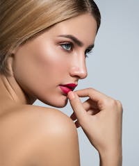 blonde woman looking over shoulder