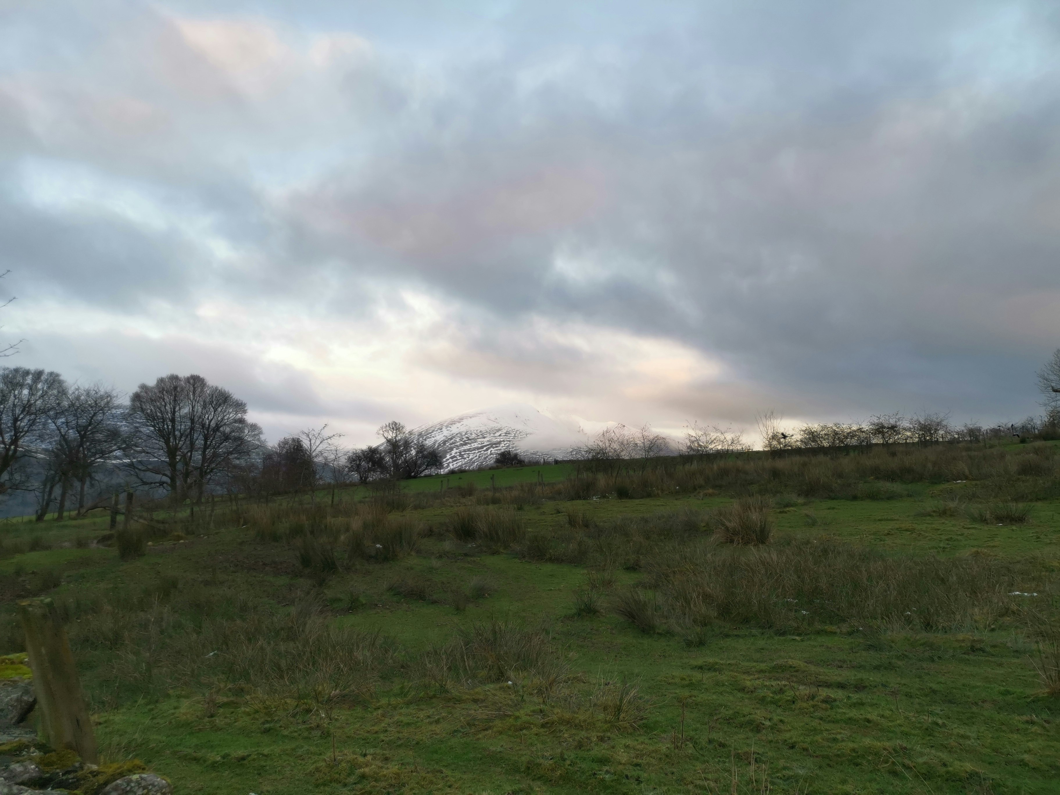 View of a hill and cloudy sky