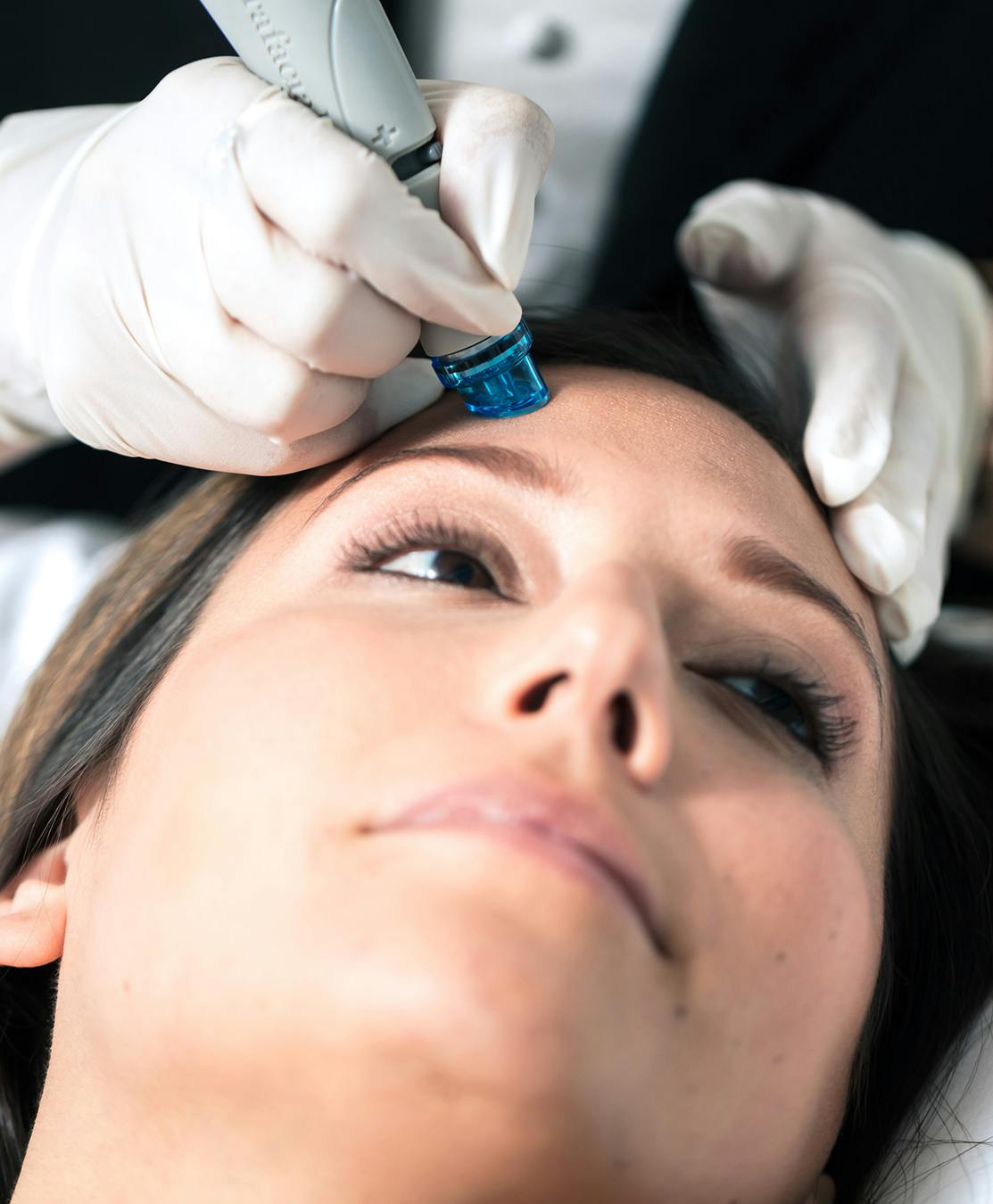 woman receiving a facial