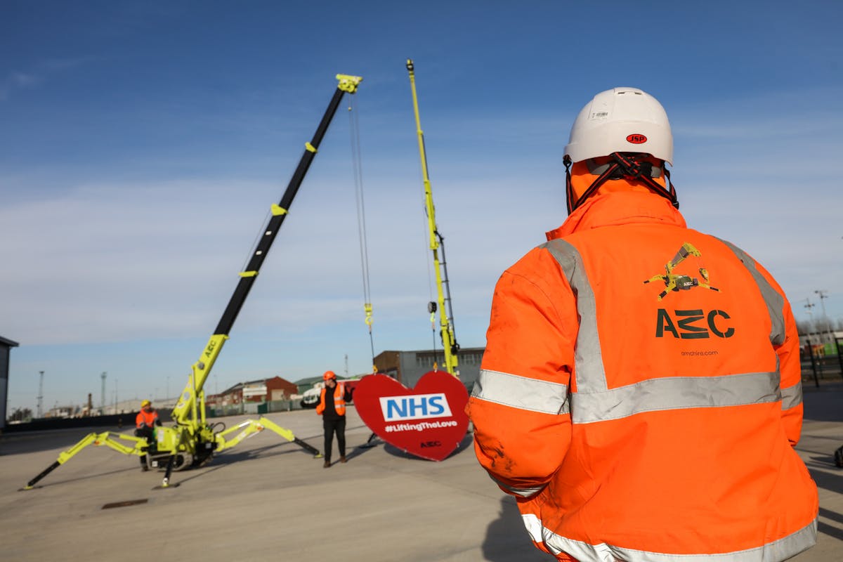 AMC c6e electric crane and MC285e lift giant nered heart for NHS R Charity