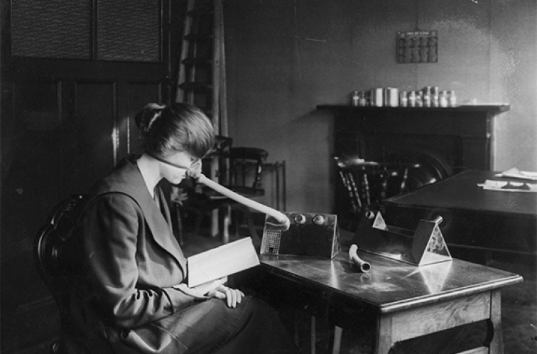 A woman social distancing while wearing a flu mask during the 1918-1919 flu pandemic.Topical Press Agency/Getty Images