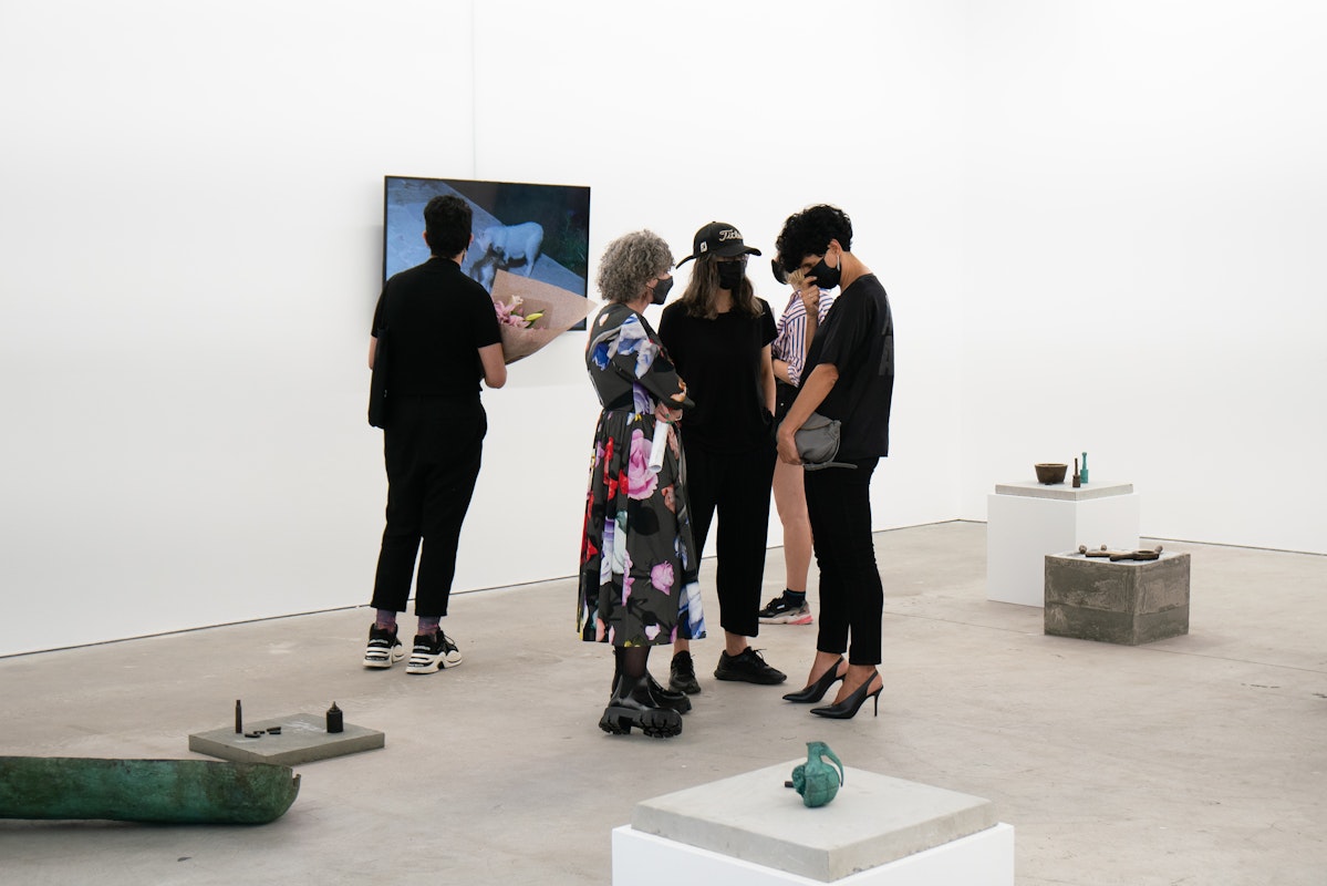 Visitors at the opening of Lara Chamas, The entrance to Paradise lies at your mother's hands, 2021, at Gertrude Contemporary. Photo: Machiko Abe