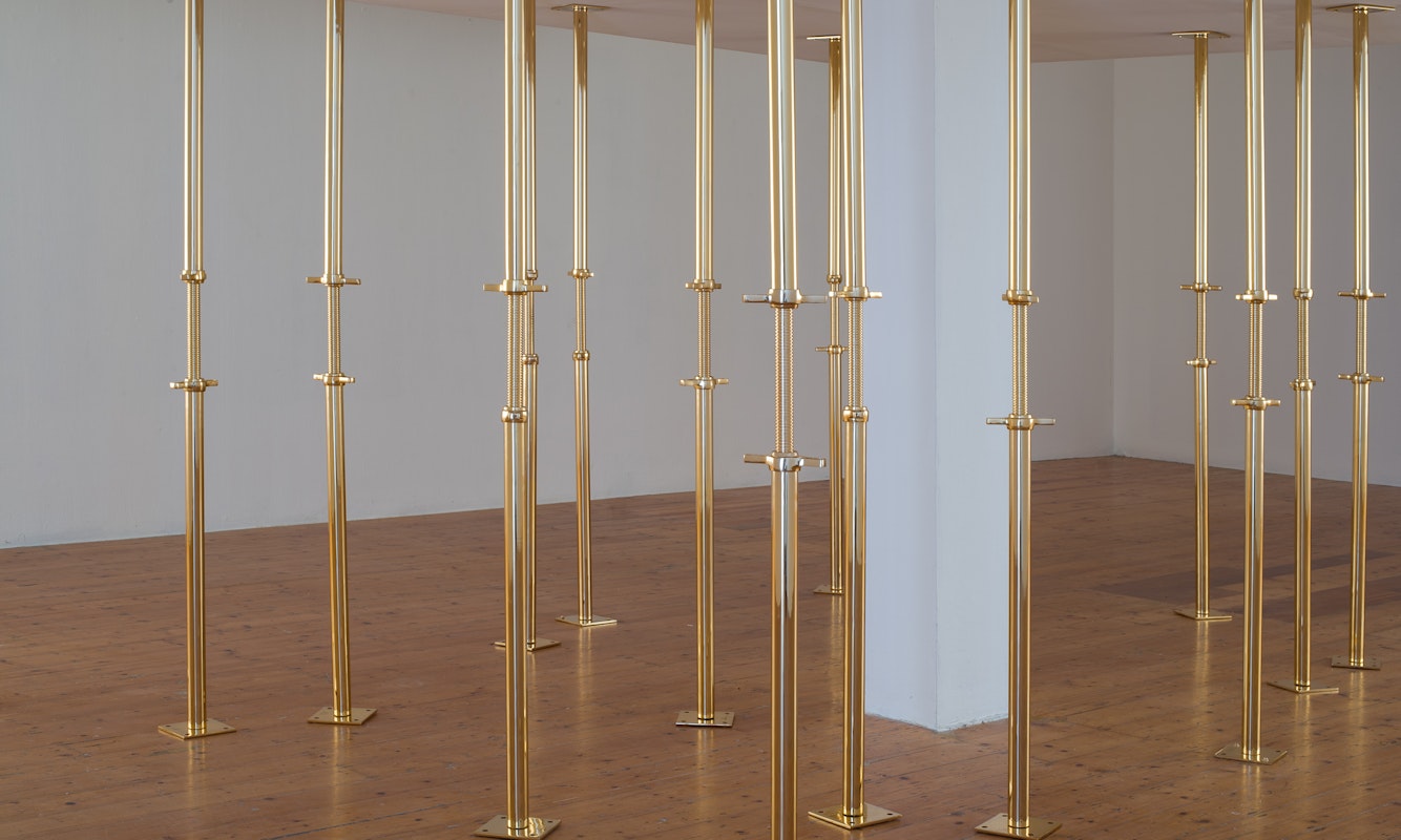 Geoff Kleem, Aegis, 2013. 2200mm 24 karat gold electroplated custom supports, drywall object