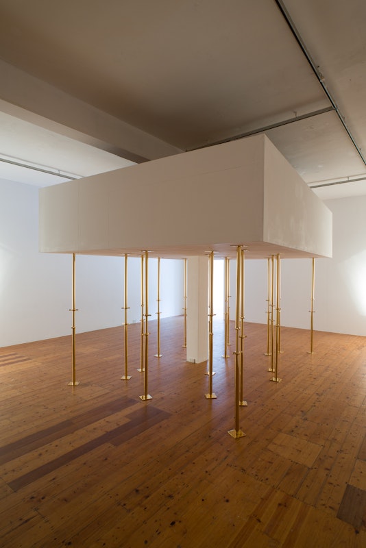Geoff Kleem, Aegis, 2013. 2200mm 24 karat gold electroplated custom supports, drywall object