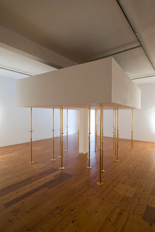 Geoff Kleem, Aegis, 2013. 2200mm 24 karat gold electroplated custom supports, drywall object