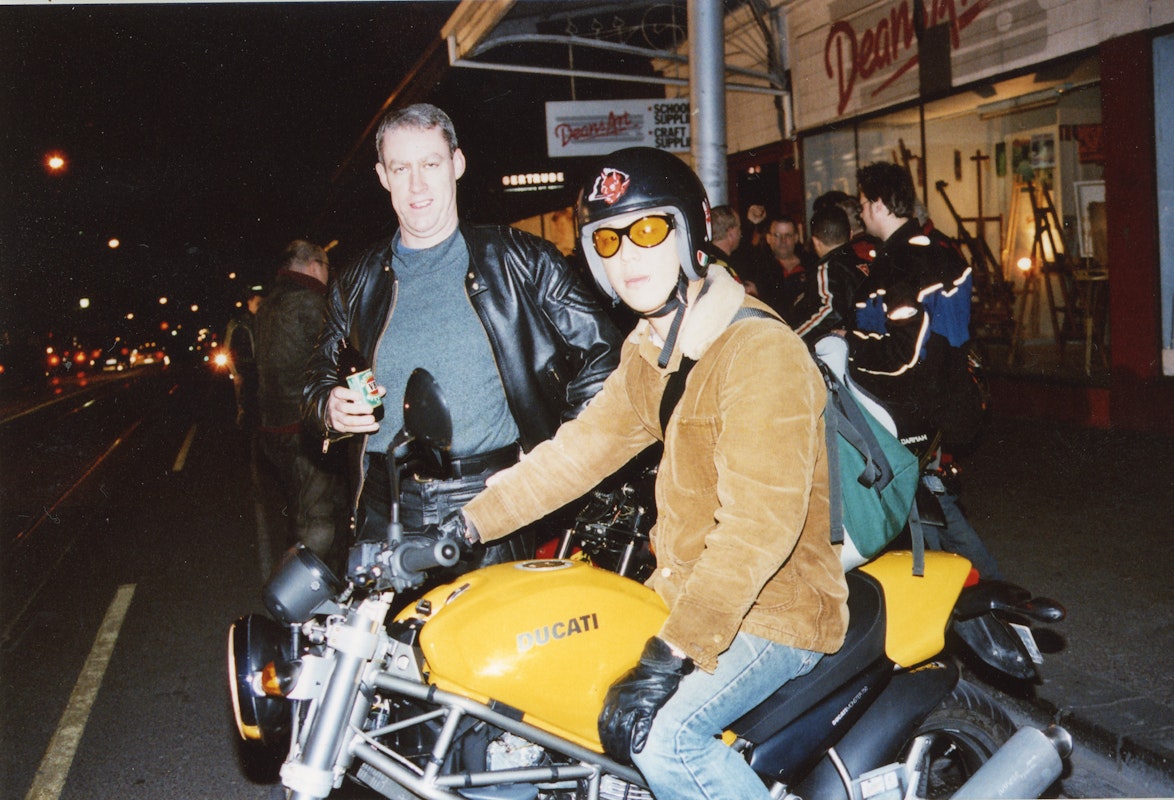 Audiences attend Simone LeAmon, MOTO Showroom, with performance riders from the Moto Guzzi motorcycle club, presented at Gertrude Contemporary Art Spaces, 2003. Courtesy of the artist and the Gertrude Archive.