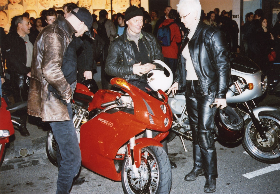 Audiences attend Simone LeAmon, MOTO Showroom, with performance riders from the Moto Guzzi motorcycle club, presented at Gertrude Contemporary Art Spaces, 2003. Courtesy of the artist and the Gertrude Archive.