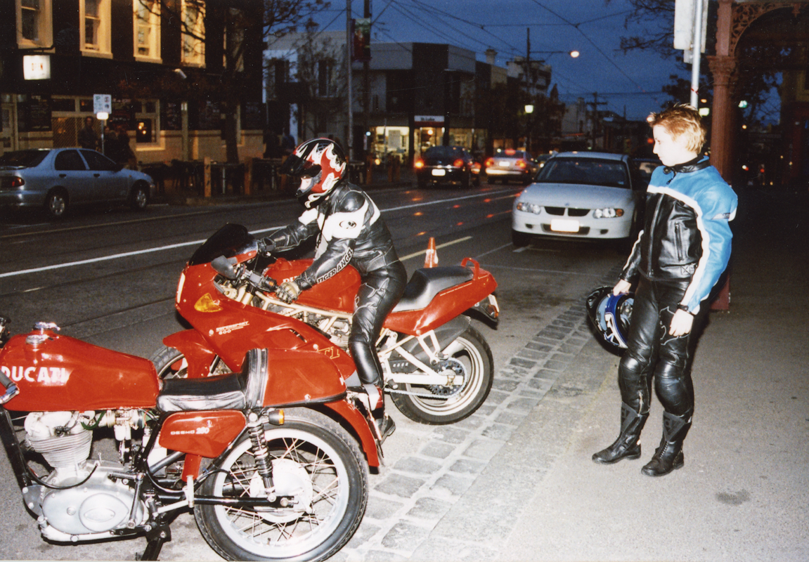 Audiences attend Simone LeAmon, MOTO Showroom, with performance riders from the Moto Guzzi motorcycle club, presented at Gertrude Contemporary Art Spaces, 2003. Courtesy of the artist and the Gertrude Archive.