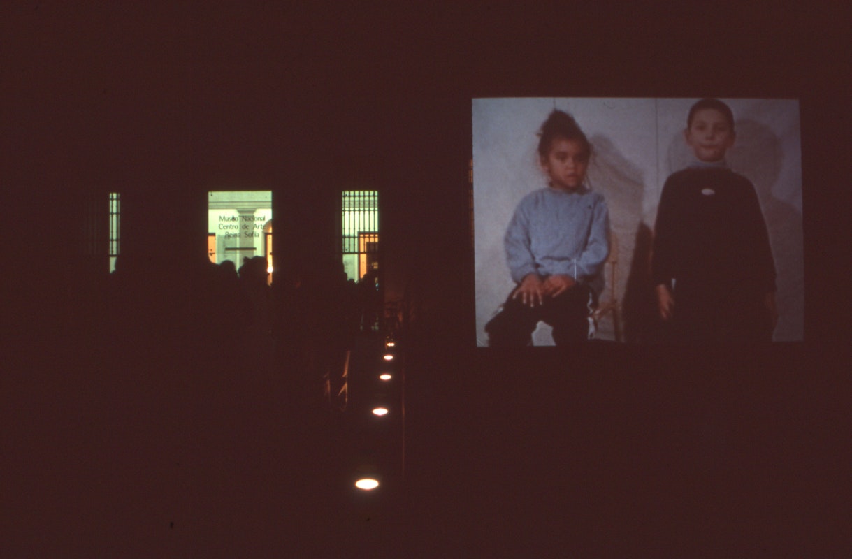 Audiences attending screen life: videos from australia, first presented at the Reina Sofia Museum, Madrid, 2002-2003. Featuring work by Destiny Deacon. Supported by the Australia Council, the South Australian Government and Arts SA and Arts Victoria. Photo courtesy of the Gertrude Archive.