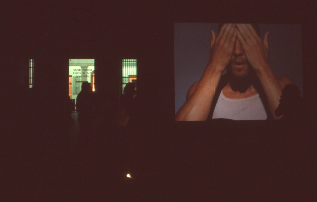 Audiences attending screen life: videos from australia, first presented at the Reina Sofia Museum, Madrid, 2002-2003. Featuring work by David Rosetzky. Supported by the Australia Council, the South Australian Government and Arts SA and Arts Victoria. Photo courtesy of the Gertrude Archive.