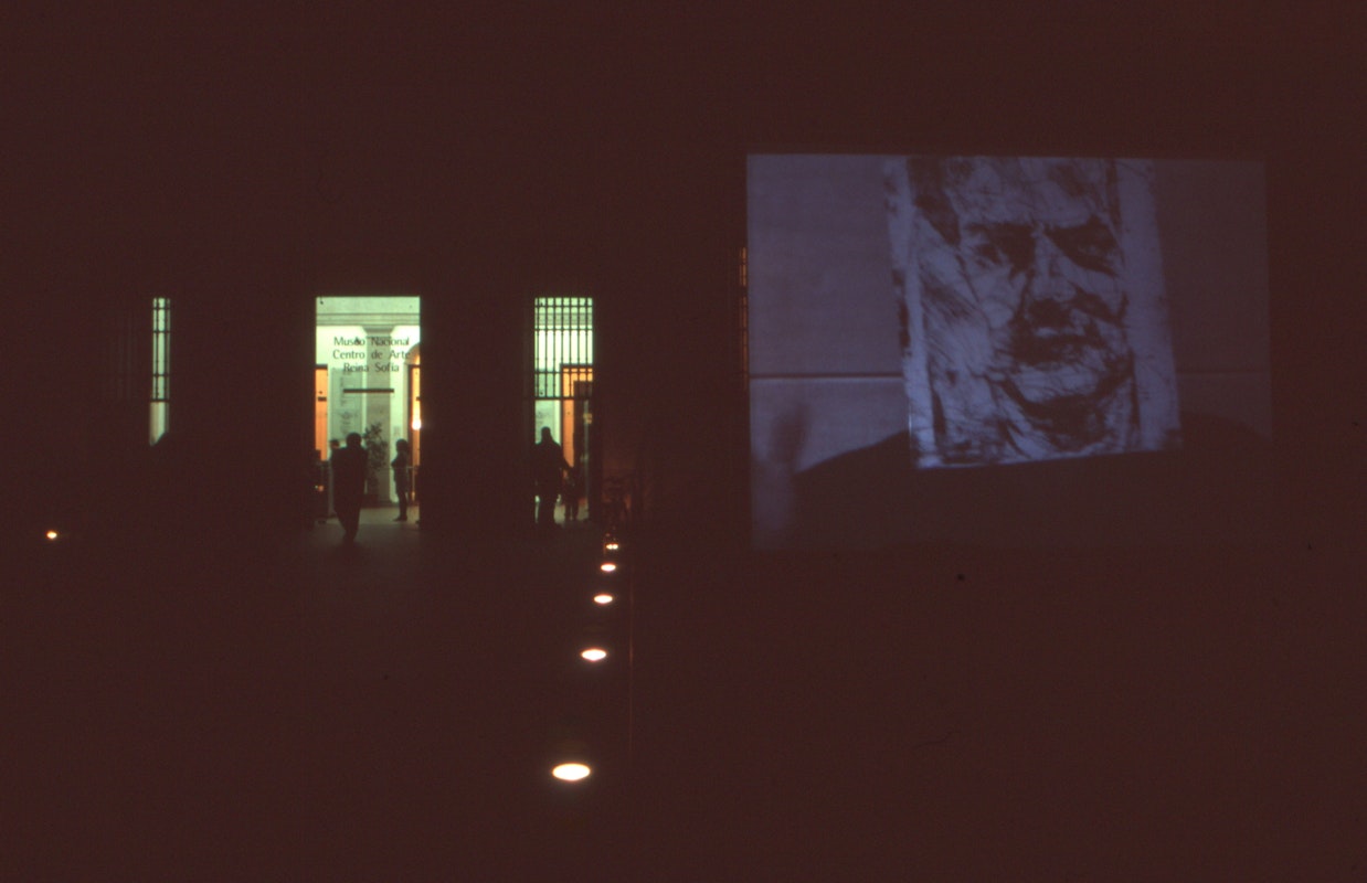 Audiences attending screen life: videos from australia, first presented at the Reina Sofia Museum, Madrid, 2002-2003. Featuring work by Mike Parr. Supported by the Australia Council, the South Australian Government and Arts SA and Arts Victoria. Photo courtesy of the Gertrude Archive