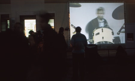 Audiences attending screen life: videos from australia, first presented at the Reina Sofia Museum, Madrid, 2002-2003. Featuring work by Philip Brophy. Supported by the Australia Council, the South Australian Government and Arts SA and Arts Victoria. Photo courtesy of the Gertrude Archive.