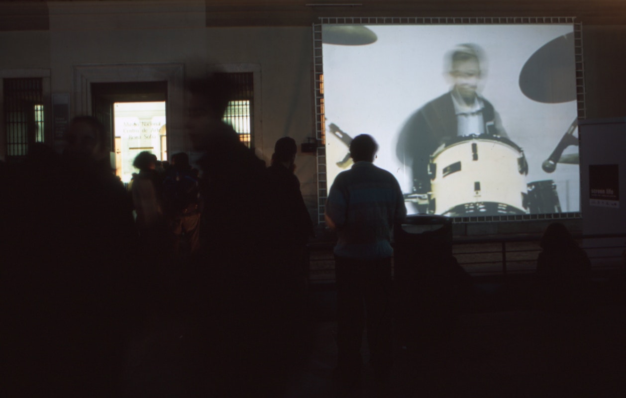 Audiences attending screen life: videos from australia, first presented at the Reina Sofia Museum, Madrid, 2002-2003. Featuring work by Philip Brophy. Supported by the Australia Council, the South Australian Government and Arts SA and Arts Victoria. Photo courtesy of the Gertrude Archive.