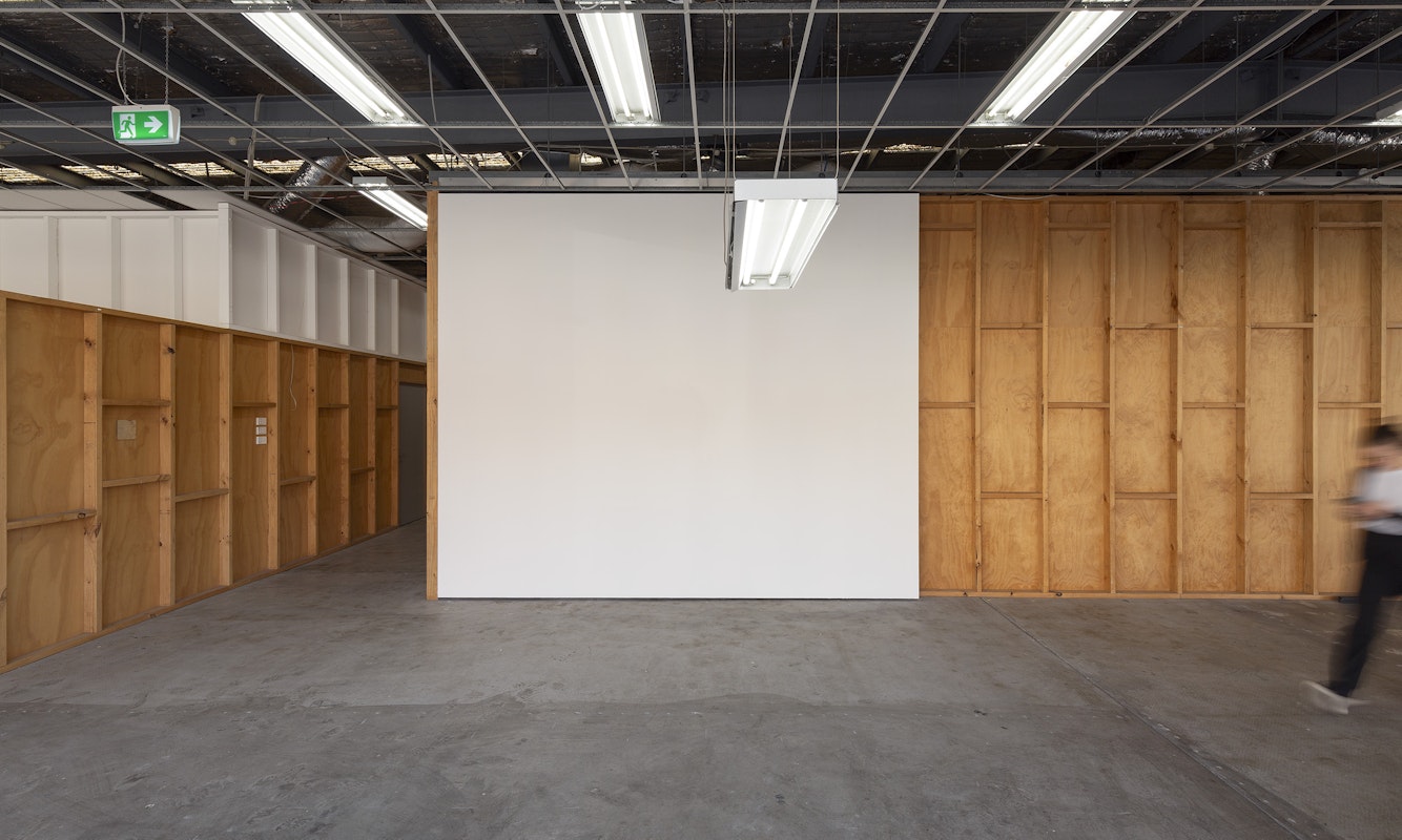 Iris Touliatou, mother light (Gertrude), 2024, installation view, And This Time the Well Is Alive, Gertrude Contemporary, Naarm Melbourne, 2024, ceiling fluorescent fixture hanging lower than existing lights in the space, image courtesy the artist and Sylvia Kouvali, Piraeus and London © the artist, photograph: Christian Capurro