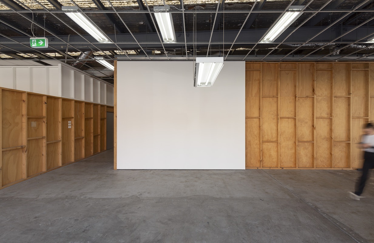 Iris Touliatou, mother light (Gertrude), 2024, installation view, And This Time the Well Is Alive, Gertrude Contemporary, Naarm Melbourne, 2024, ceiling fluorescent fixture hanging lower than existing lights in the space, image courtesy the artist and Sylvia Kouvali, Piraeus and London © the artist, photograph: Christian Capurro
