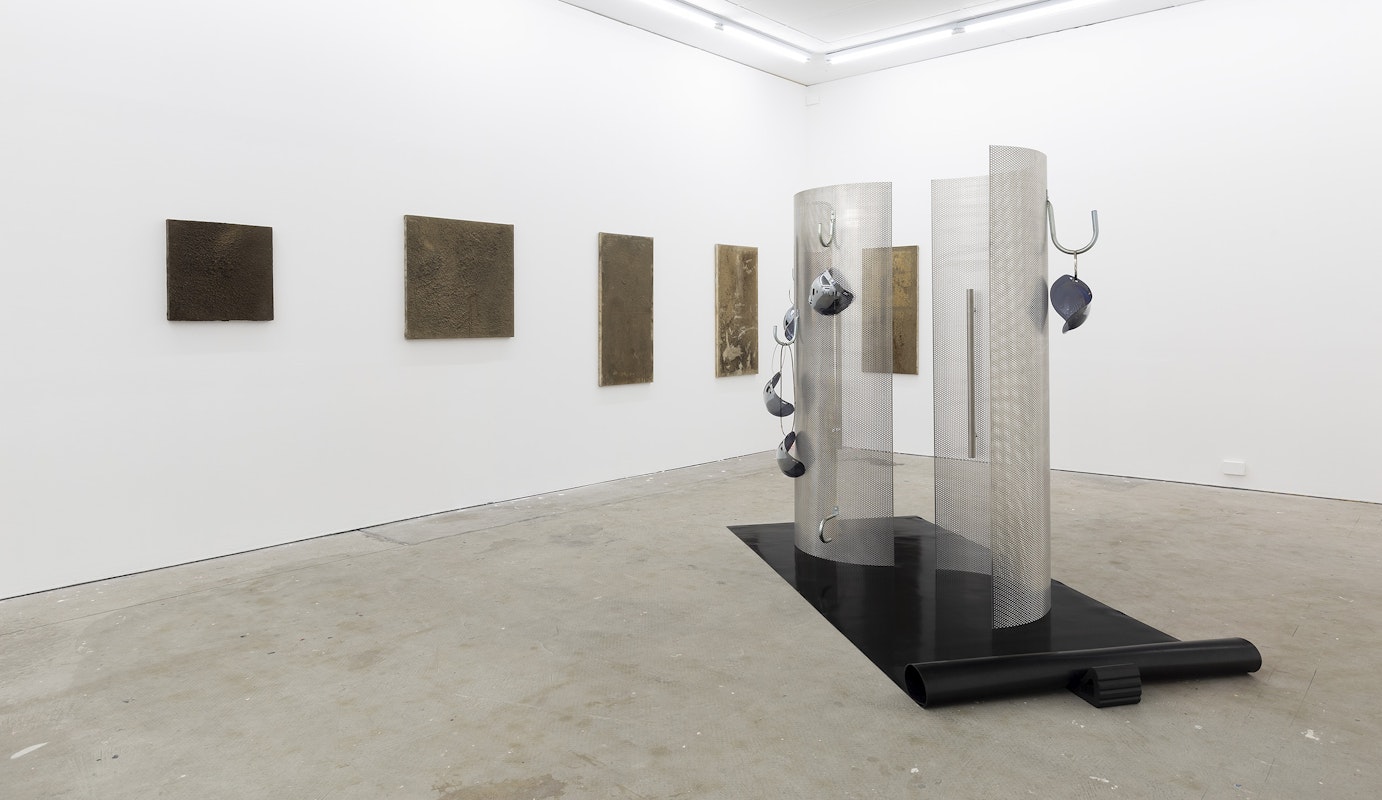 Darcy Wedd, Untitled IX, 2022, Untitled III, 2022, Untitled I, 2022, Untitled V, 2022, Untitled II, 2022, dust (aluminium, steel, wood, acrylic, copper, brass, micarta), lemel, clear gum glue, PVA, varnish on canvas; Burchill/McCamley, Reflectors and Absorbers, 2016, perforated aluminium, stainless steel, mirrored Perspex, rubber, installation view, And This Time the Well Is Alive, Gertrude Contemporary, Naarm Melbourne, 2024, image courtesy and © the artists, photograph: Christian Capurro