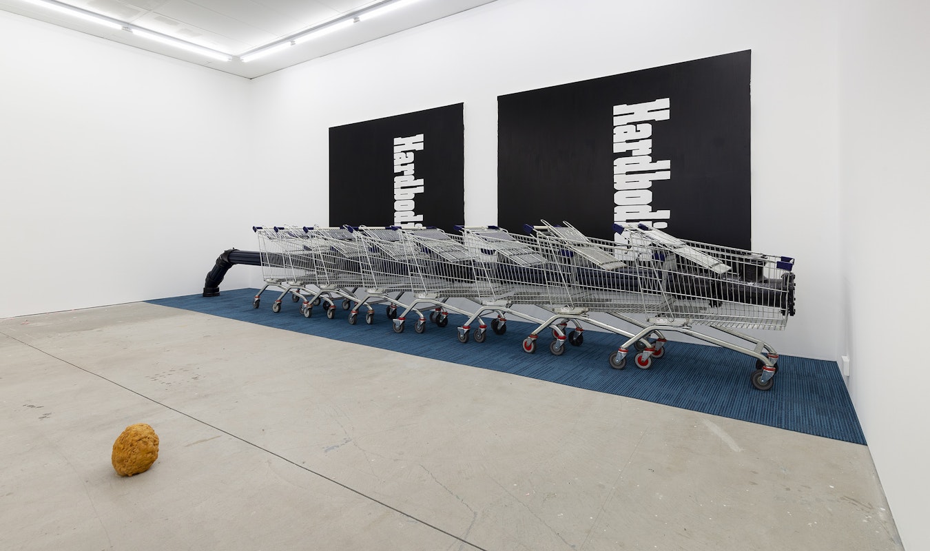 Erin Hallyburton, Oilstones (detail), 2024, instant batter mix, water, vegetable oil; Alexandra Peters, Bottleneck, 2024: Foreign Line Extraction IV (Mains), 2024, vinyl, polyurethane ‘open cell’ foam and pine, enamel on ductile iron, acrylic, shopping trollies, Leg Over Leg, 2024, commercial carpet tiles, Hardbodies I, 2024, acrylic on canvas, Hardbodies II, 2024, acrylic on canvas, installation view, And This Time the Well Is Alive, Gertrude Contemporary, Naarm Melbourne, 2024, image courtesy and © the artists, photograph: Christian Capurro