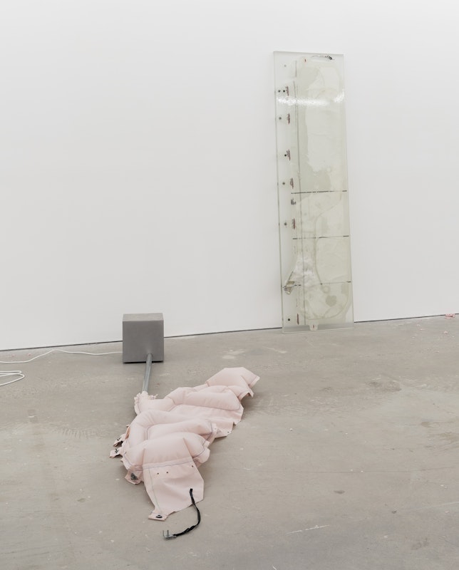 Alicia Frankovich, Blow up (deployed Tesla Air bag), 2023-24, deployed Tesla air bag, motor, timer, steel box, galvanised steel; Deep freeze (deployed Tesla Air bag), 2023-24, deployed Tesla air bag, epoxy resin, installation view, And This Time the Well Is Alive, Gertrude Contemporary, Naarm Melbourne, 2024, image courtesy the artist and 1301SW, Naarm Melbourne and Sydney © the artist, photograph: Christian Capurro
